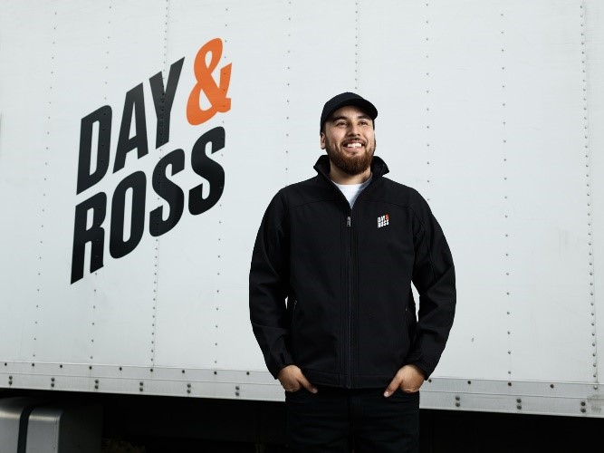 Driver standing by Day & Ross truck