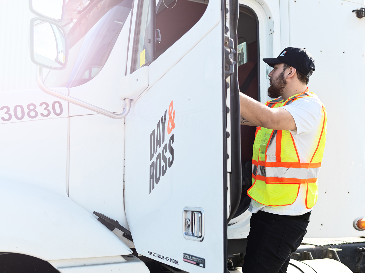 Professional driver getting in the truck to get on the road